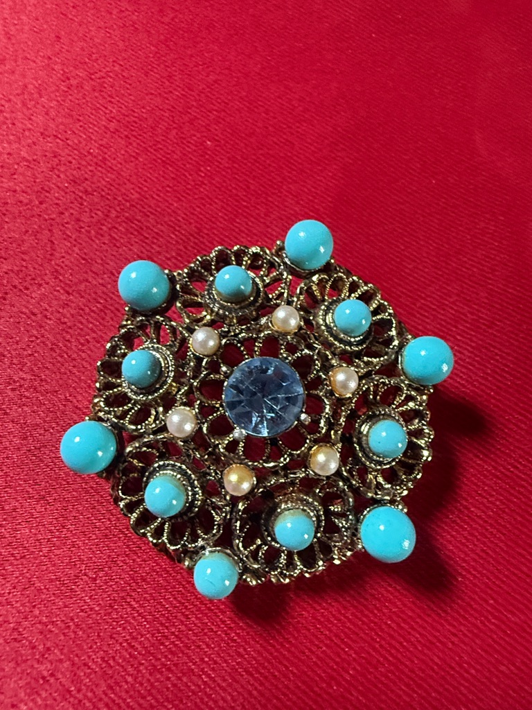 Gold-Tone Filigree Brooch With Turquoise Cabochons And Blue Crystal Center